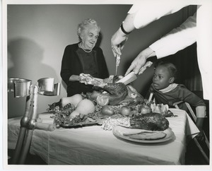 Serving turkey to Mrs. Fannie Fischbach and Donna Robinson