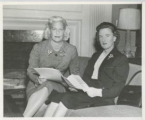 Margaret Milbank Bogert and Mrs. Robert M.N. Smith reviewing paperwork