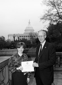 Congressman John W. Olver (right) presenting certificate of special congressional recognition to Catherine Barron for outstanding academic achievement