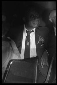 James Baldwin seated in the audience at his birthday celebration