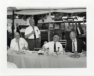 John F. Collins attending an outdoor luncheon event