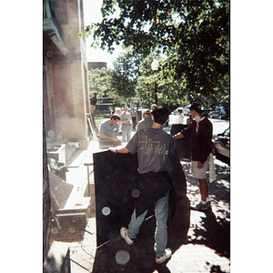 Volunteers cutting boards for use by the Jorge Hernandez Cultural Center.