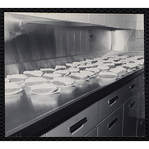 Plated slices of pie wait on a kitchen counter at a Dad's Club/Mother's Club banquet