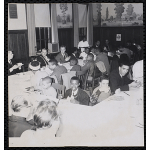 Men and boys attend a Dad's Club banquet
