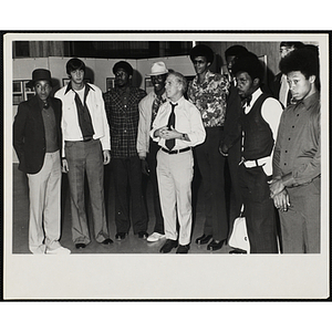 Mayor of Boston Kevin H. White (center) poses with nine young men