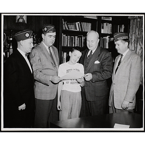 A boy poses with three veterans and Executive Director Arthur T. Burger (2nd from right)