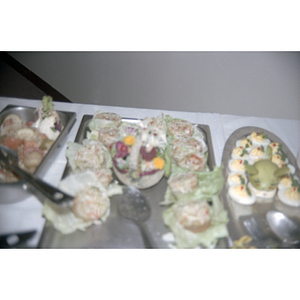 Table is lined with food at a Chinese Progressive Association event