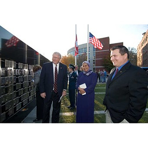 Neal Finnegan and two others look at the Veterans Memorial at the dedication ceremony