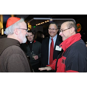 Guests socializing at the Beanpot Tournament Reception