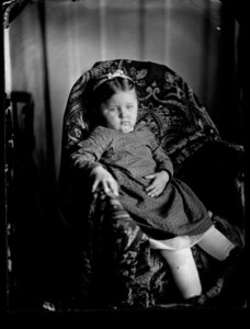 Portrait of a child seated in a chair