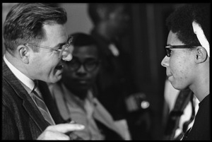 Unidentified man talking with Jean Wheeler at the Youth, Non-Violence, and Social Change conference, Howard University