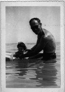 Sidney Lipshires and baby in the ocean