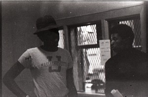 Two unidentified African American men (one in UMass Amherst t-shirt) in the UMass Student Union