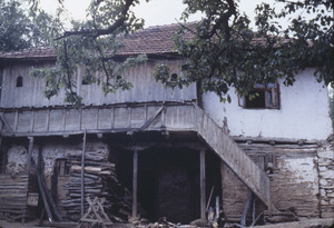 Volce dwelling with wood pile