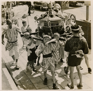 Boys carrying a float in a matsuri procession
