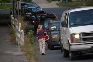 Protest against a pornographic video store in Northampton: protester handing out fliers to cars on North Street