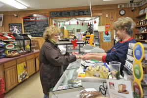 Sales transaction at the counter, New Salem General Store