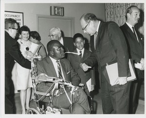 Group of people with man in wheelchair