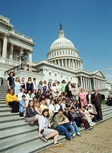 Congressman John W. Olver with group of visitors, posed on the steps of the United States Capitol building