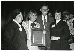 Mayor Raymond L. Flynn and wife Catherine (Kathy) receiving a plaque from two unidentified nuns at a Labouré Center event