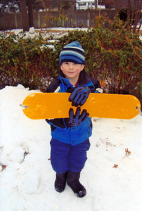 Calvin with improvised snowboard