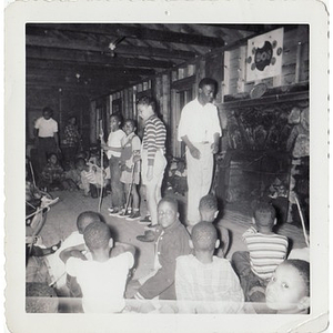 Photograph of boys gathered for activities in a cabin at Breezy Meadows Camp