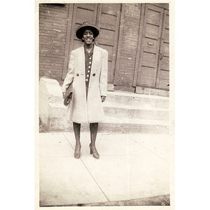 Belle Rotch stands in front of church