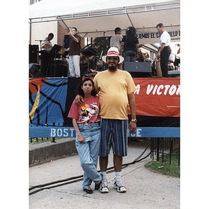 Portrait of a couple posing near the stage at Festival Betances.