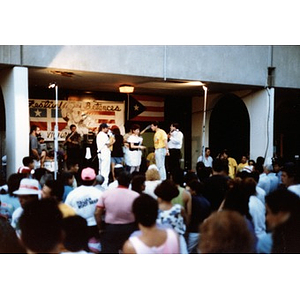 Performers gathered under an arcade at Festival Betances.