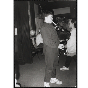 "Irish" Mike Murphy, Charlestown Boys and Girls Club member, playing bagpipes