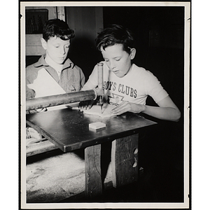 Two boys from the Boys' Clubs of Boston working on their woodworking project