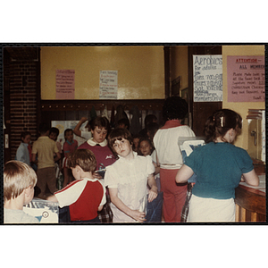 A Group of children receiving their new shirts during an open house