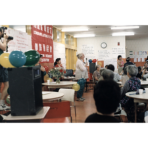 Woman addresses members of the Chinese Resident Association at a celebration