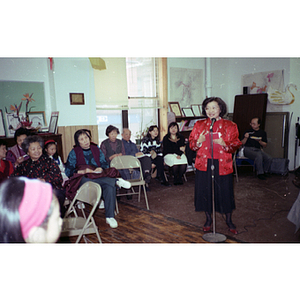 Suzanne Lee addresses a group gathered to celebrate the Chinese New Year at the Chinese Progressive Association's office