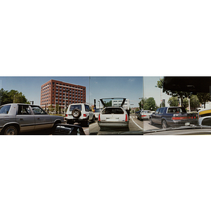 Panoramic view of cars stopped at a red light