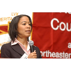 Mary Sharon Owens speaks with a microphone at The National Council Dinner