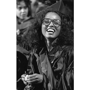 A graduate laughs at Law School commencement