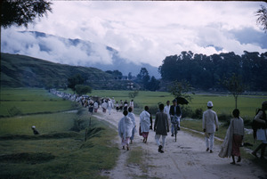 People walk to festival