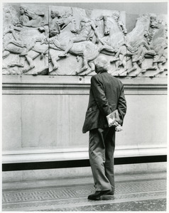 Man looking at Elgin Marbles