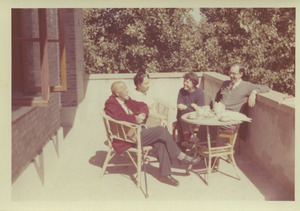 W. E. B. and Shirley Graham Du Bois having tea with unidentified man and woman