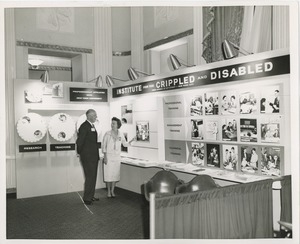 Man and woman in front of ICD exhibit