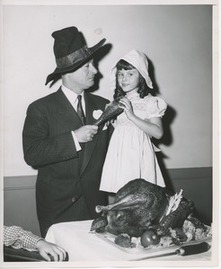 George Jessel with young client in Thanksgiving costume