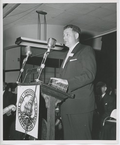 Willis C. Gorthy speaking behind podium at Institute Day