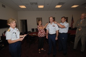 Commander Mark Fedor (center), US Coast Guard, being sworn in as Special Detailee to House Appropriations Committee