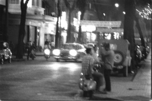 Scenes on rue Tu Do at night; Saigon.