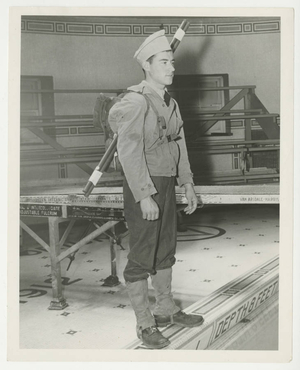 Soldier standing on the edge of the pool in McCurdy Natatorium (1942)
