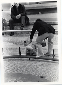 Child tripping over a fountain component in Boston Common