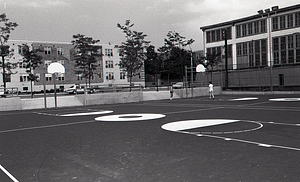 Teenagers playing basketball at Lo Presti Park