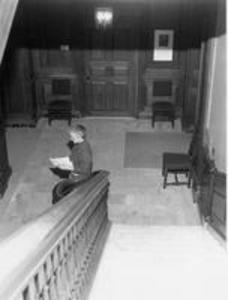 Stetson Library staff member at the foot of the south staircase