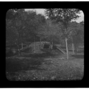 Shelter built into a hill in the woods